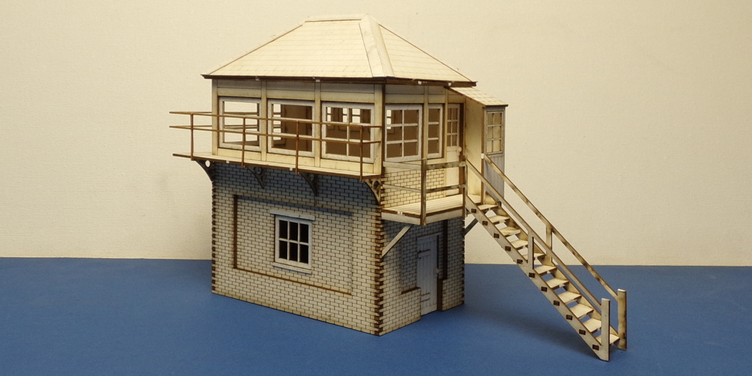 B 70-27R O gauge SR style signal box - right stairs This signal box is based on the recently demolished Wool Signal box (LSWR design opened in 1890's then under Southern Railway). Based on the earlier version before it was extended. Model includes new door knobs as well as railings made with 0.8mm plywood to get it closer to prototypical fineness.  
